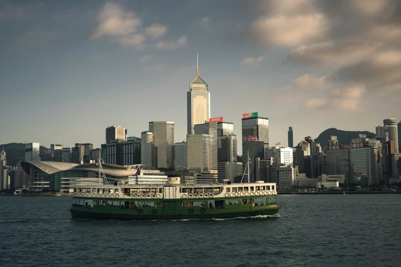 a ferry in the harbor of a large city