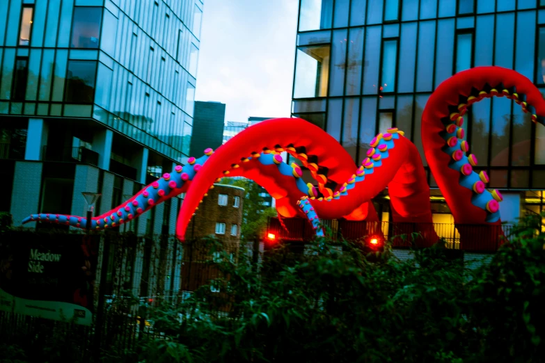 two large balloons sitting in the shape of a giant dragon