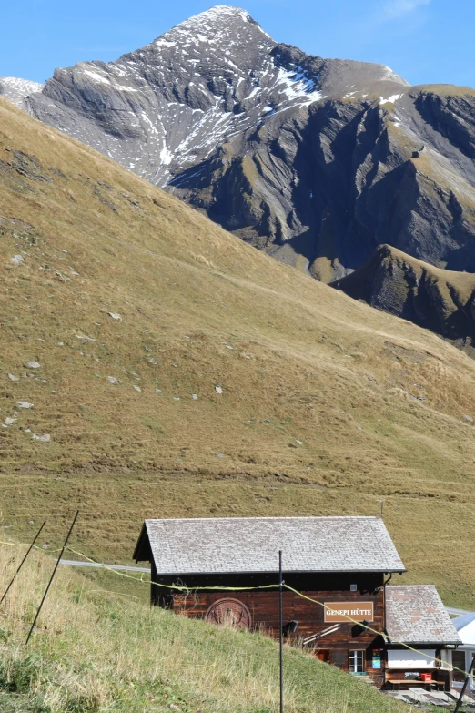 an old log cabin nestled in the mountainside