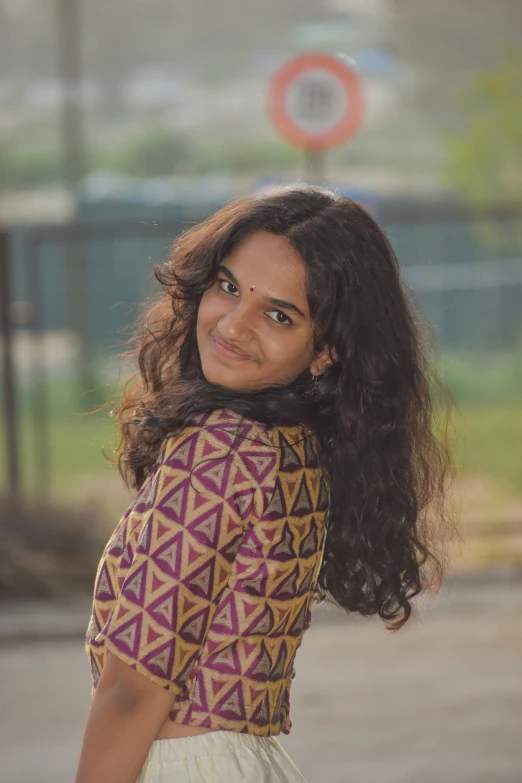 a woman with large hair posing for a po