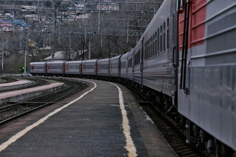 a train is traveling along tracks in a small town