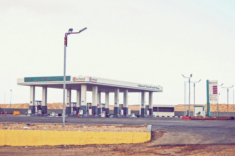 the gas station is empty during a rainy day