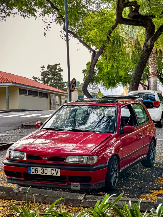 a red car parked on the side of the road