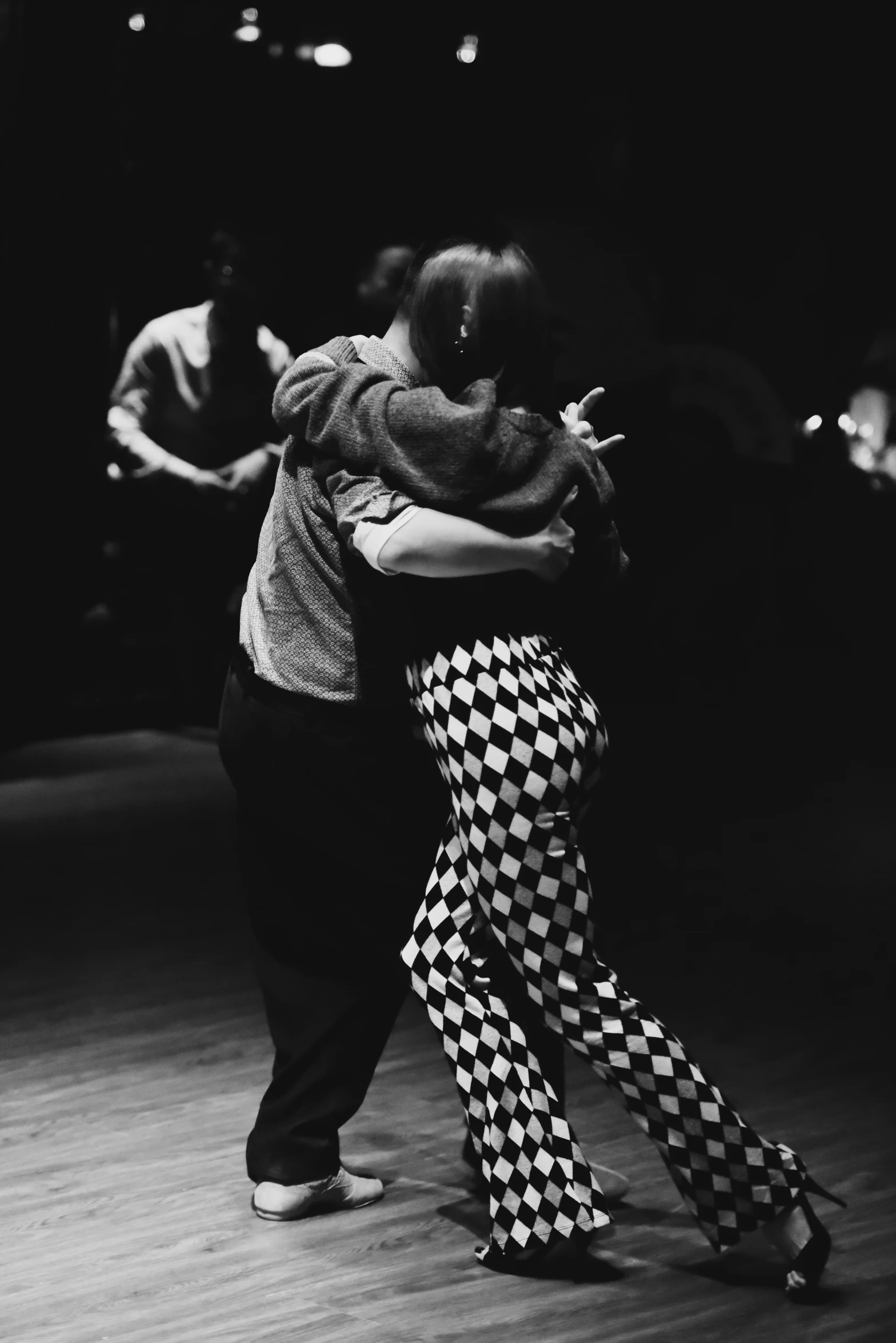 the two people are dancing together in a dance class