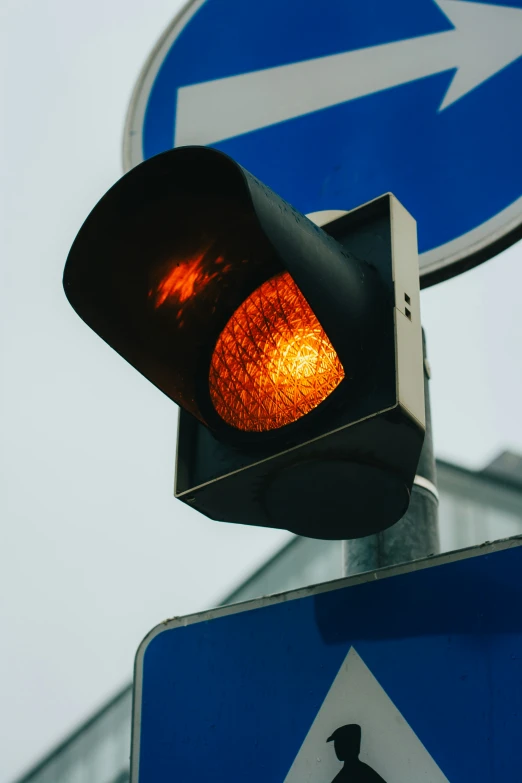 the traffic light is close to the road sign