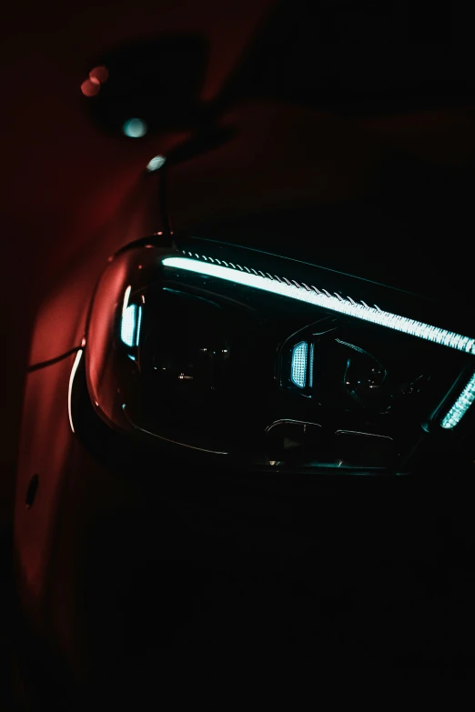 a car that has some lights on in the dark