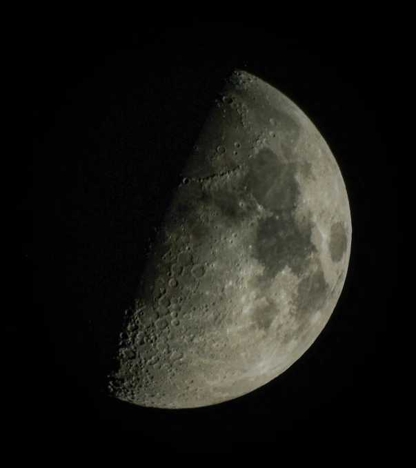 a close up po of the moon with some clouds