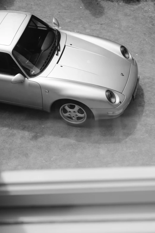 a close up of a car parked on a road