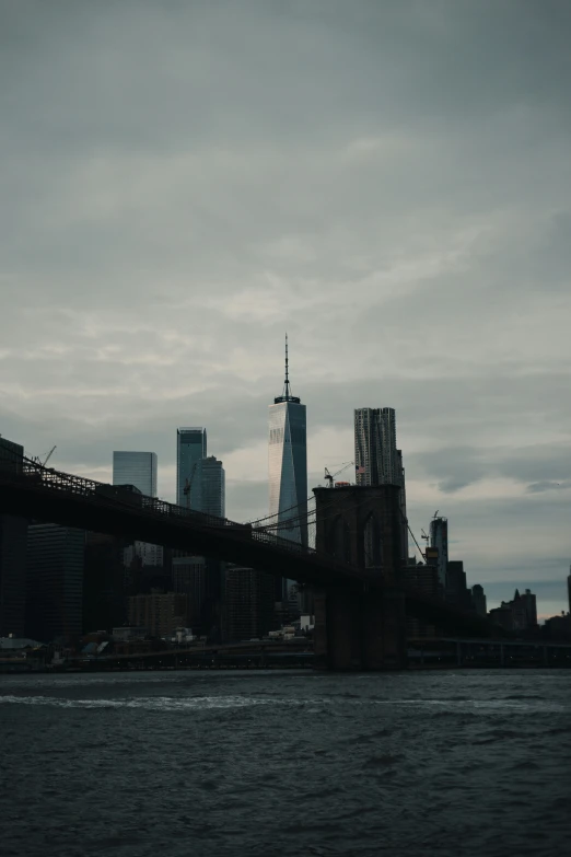 an old picture of the brooklyn bridge and lower manhattan, new york