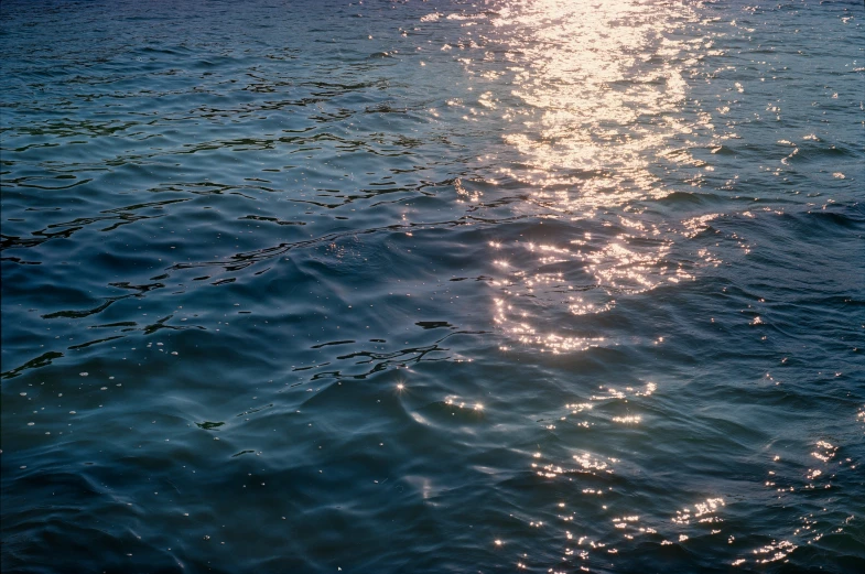 the bright sun shines brightly in the water