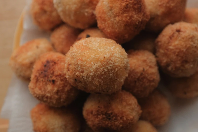 a close up image of donuts sitting on a napkin