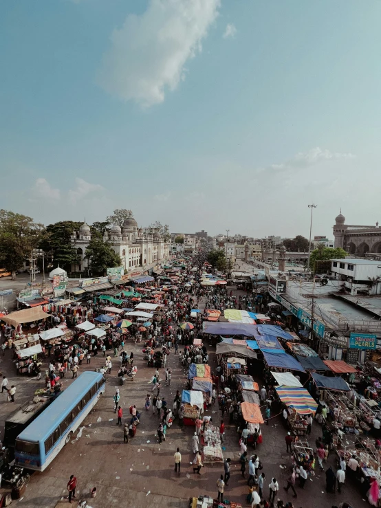 several vendors in a market square during the day