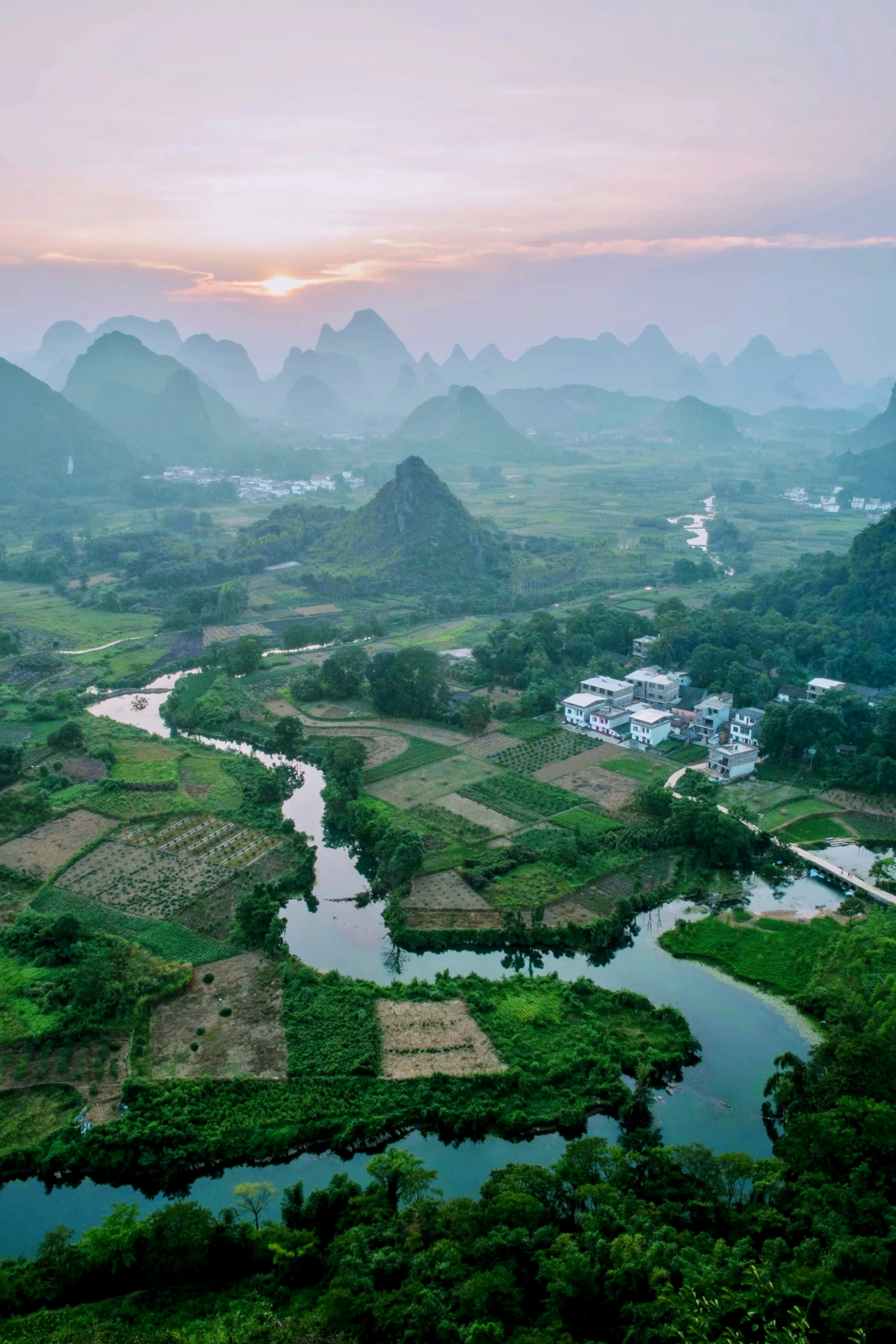 a landscape that looks like a valley surrounded by mountains