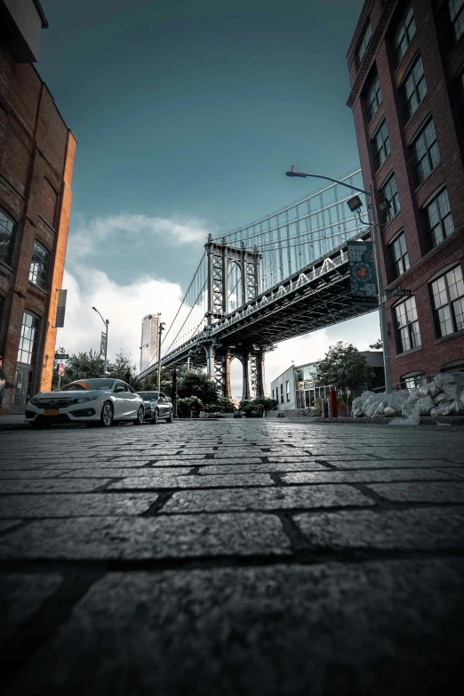 a car driving across an overpass in the middle of a city