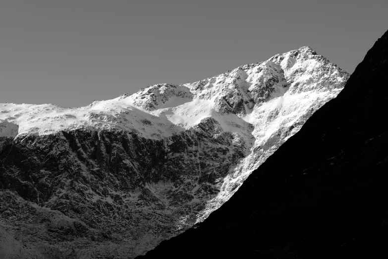 the peak of a mountain covered in snow