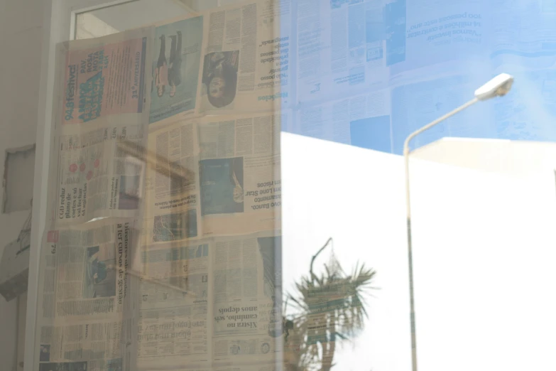 window in building with newspaper in the windowsill