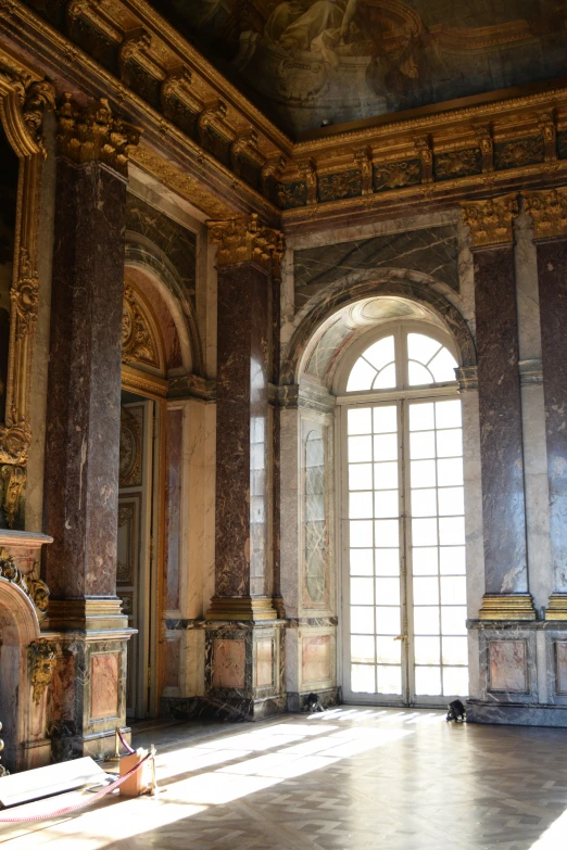 an ornate building with a big window that's opened in to it