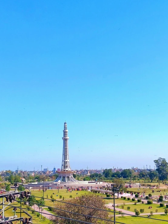 the clock tower stands high in the blue sky