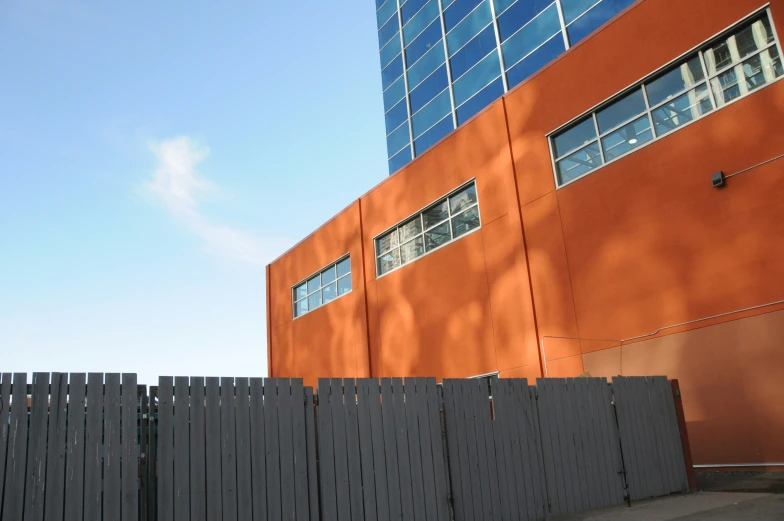 a building with a black fence next to it