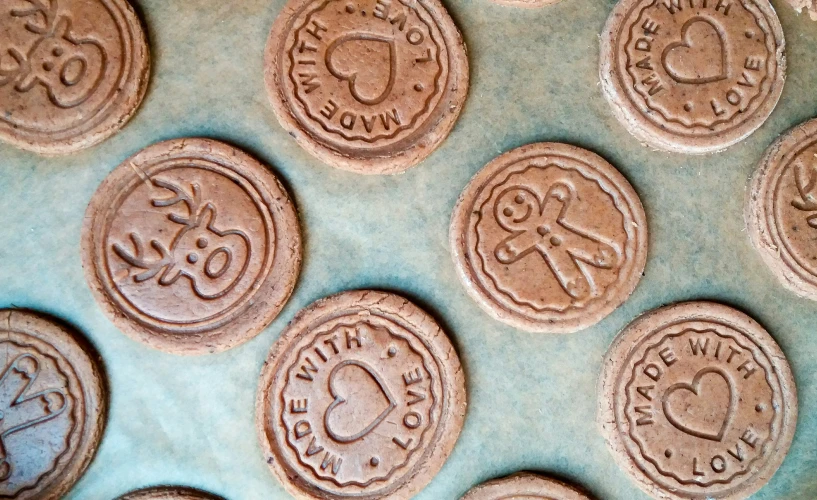 there are several different cookies and two in the middle of a baking tray