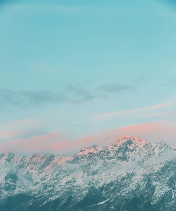 a snowboarder in the mountains on his board