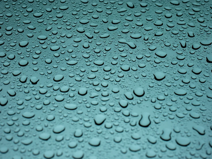 water drops are shown on the blue surface