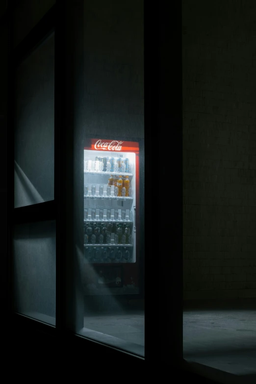 a display case full of soda bottles and drinks