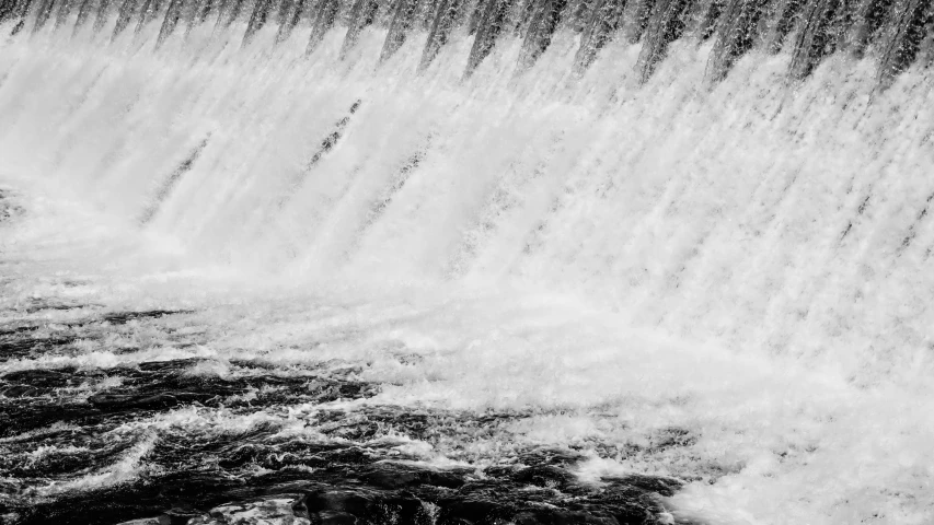 a black and white po of a waterfall