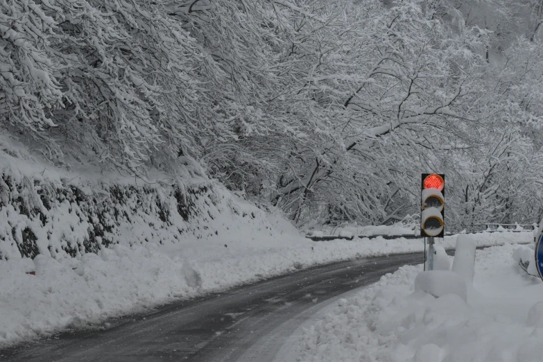 a car on the road as it sits in the snow