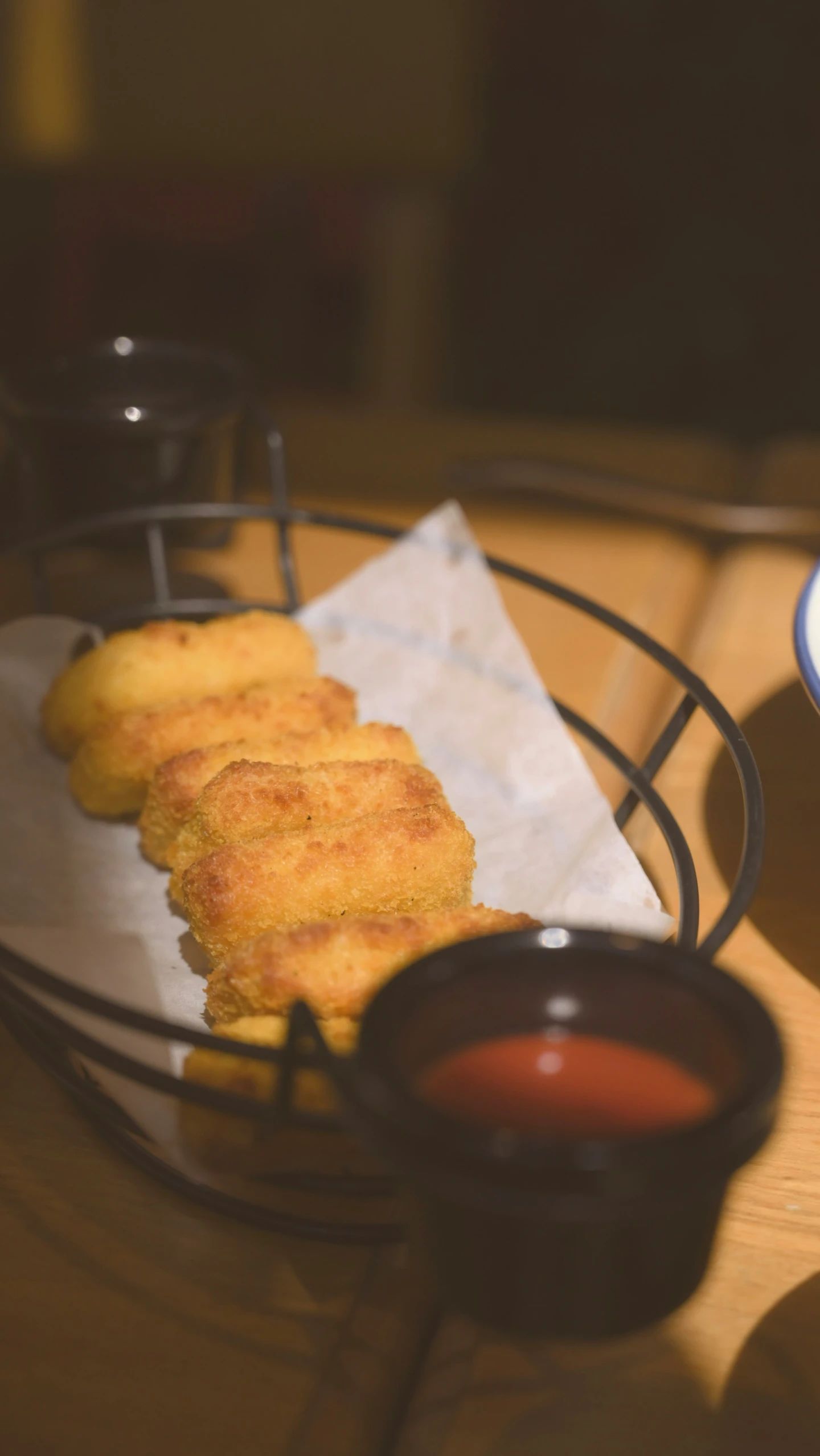 fried bread sticks with dipping sauce on a plate