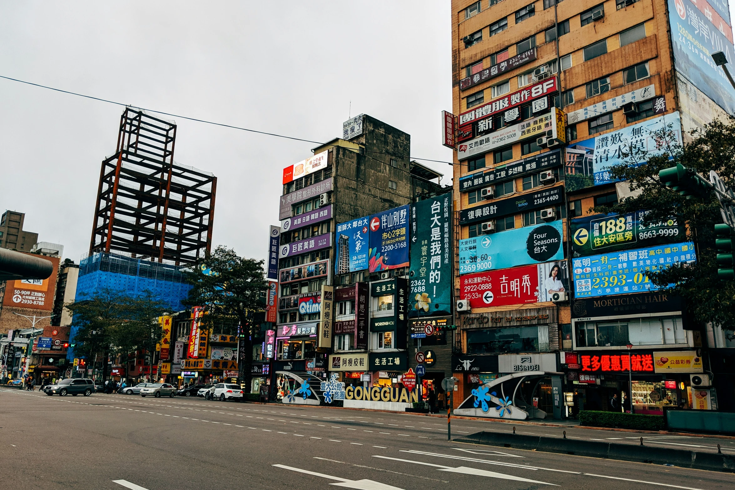 the street in the city is full of billboards