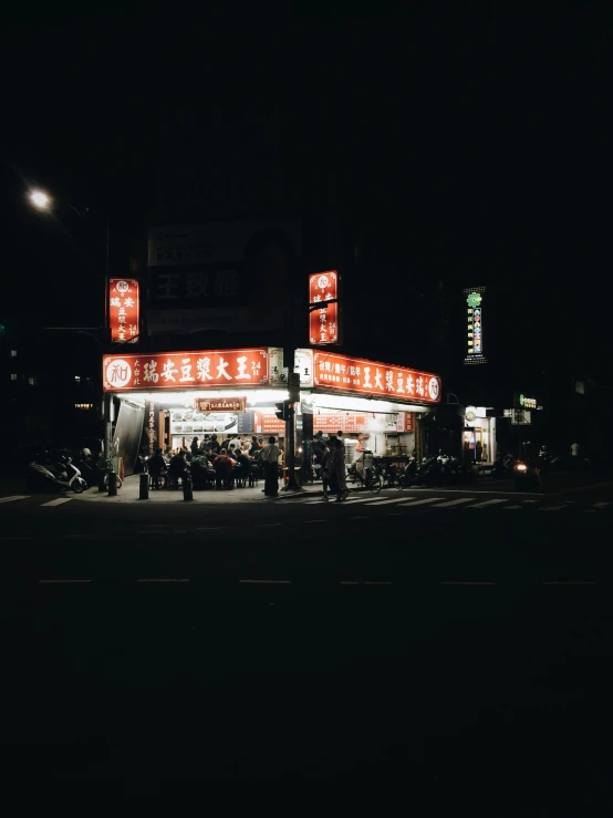 an asian chinese market lit up at night