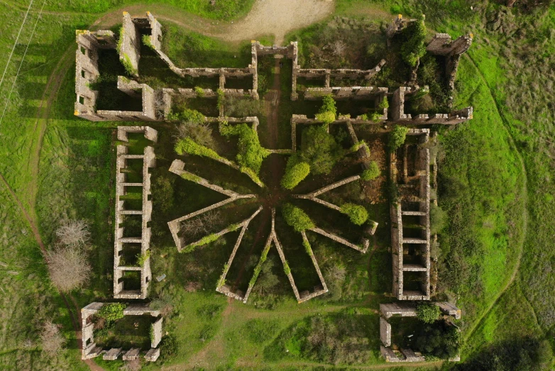 a large building on top of a lush green field