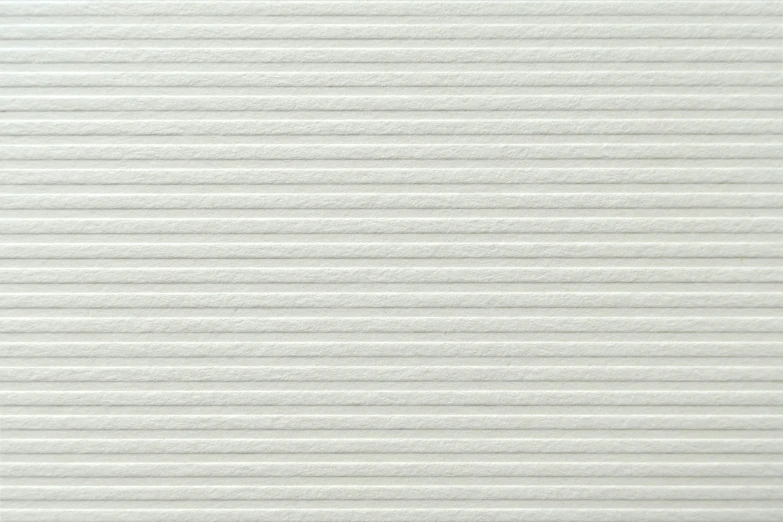 a textured white wall background with horizontal lines