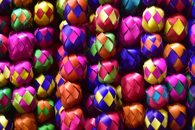 many different colored balls that are stacked together
