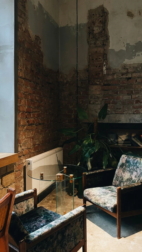 two chairs and a sofa in a room under construction