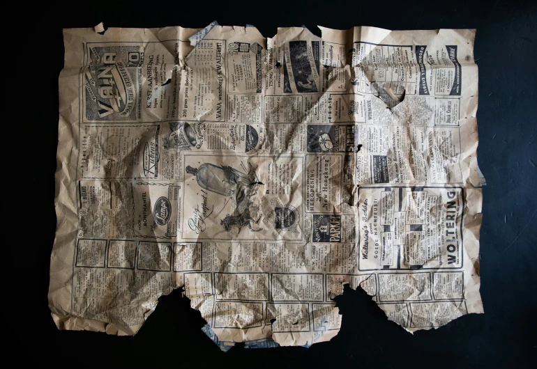 an old piece of newspaper is shown with newspaper clippings