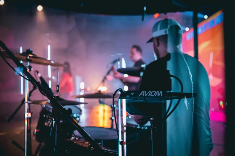 a musician playing the keyboard and some instruments