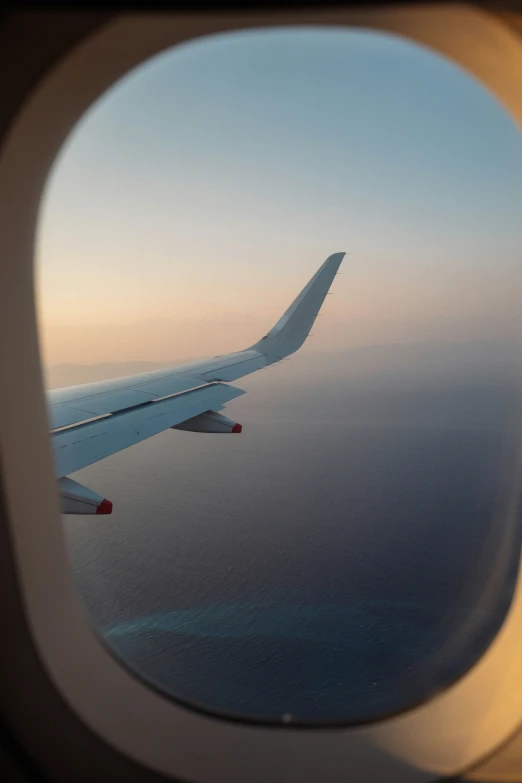 the view out an airplane window shows the wing