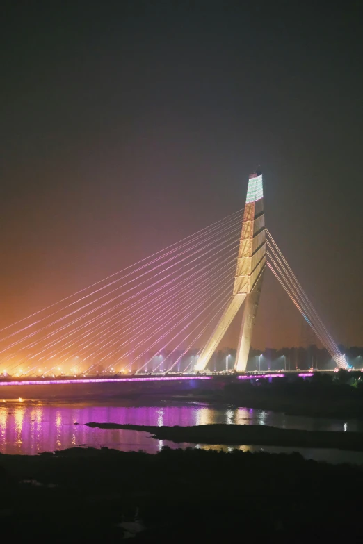 a very nice bridge with a bunch of lights at night