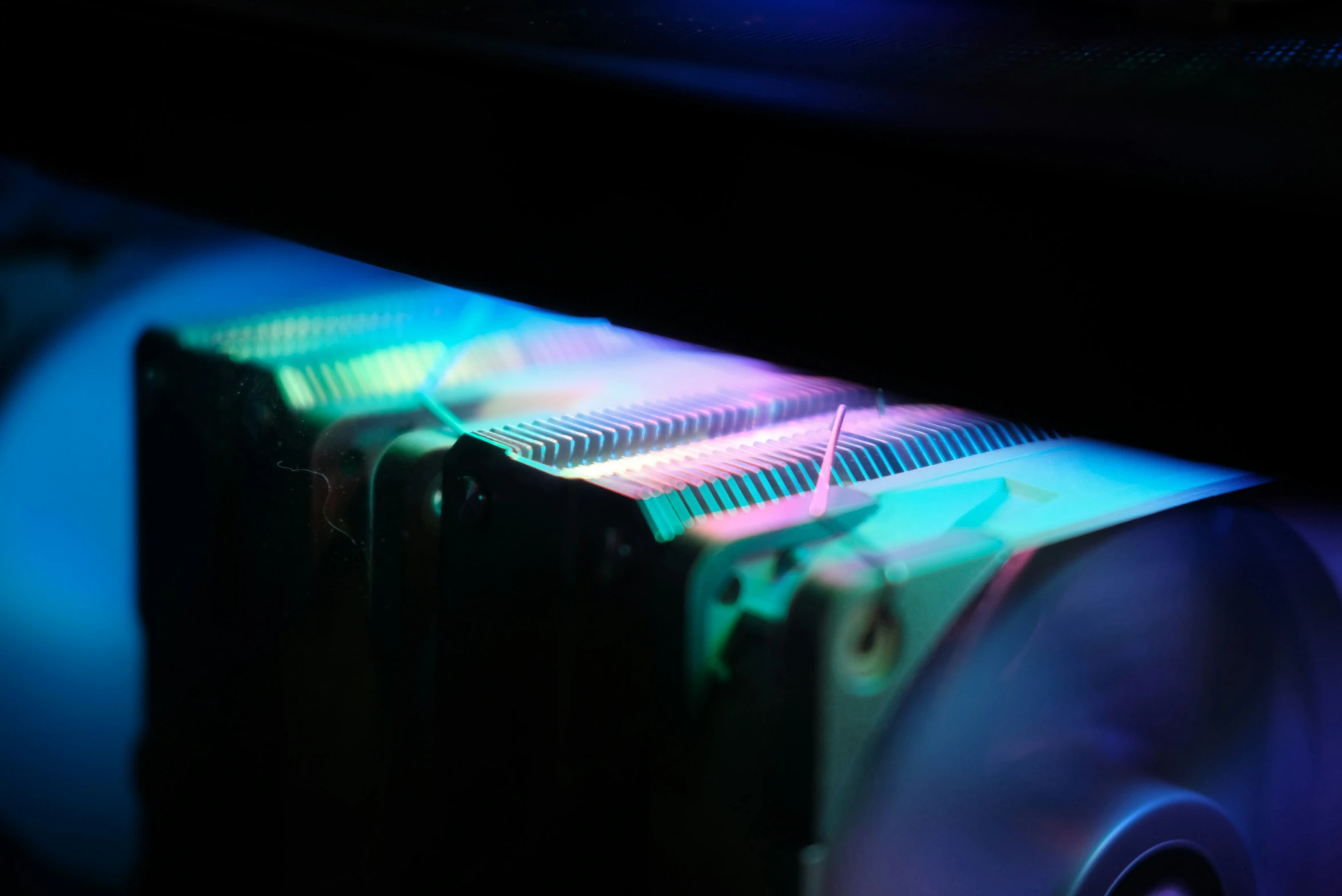 a desktop computer fan sitting in front of a computer keyboard