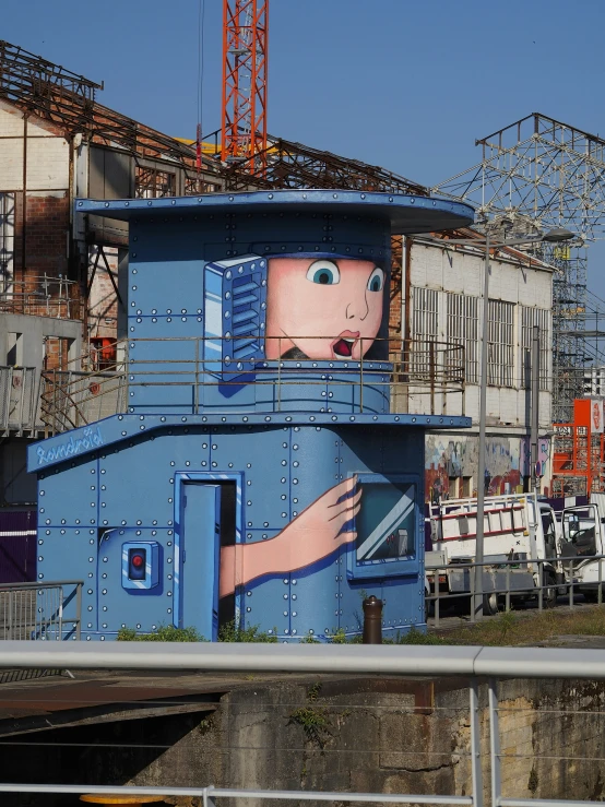 a large blue building with some art on it