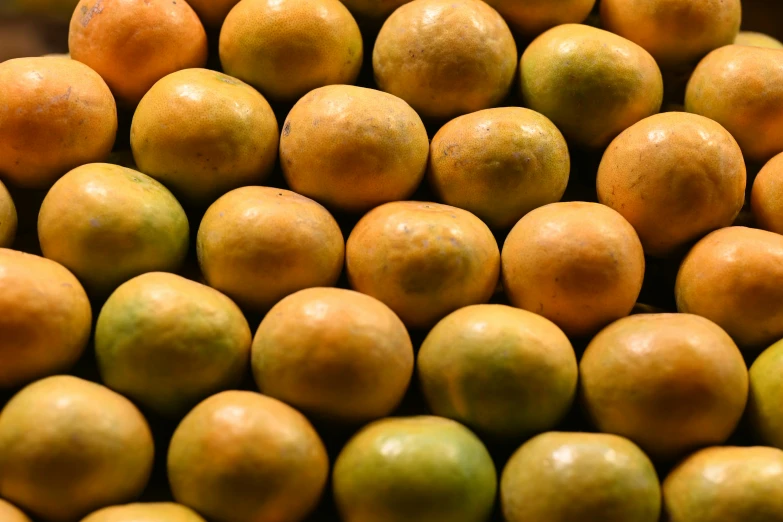 a large amount of tangerines displayed for display