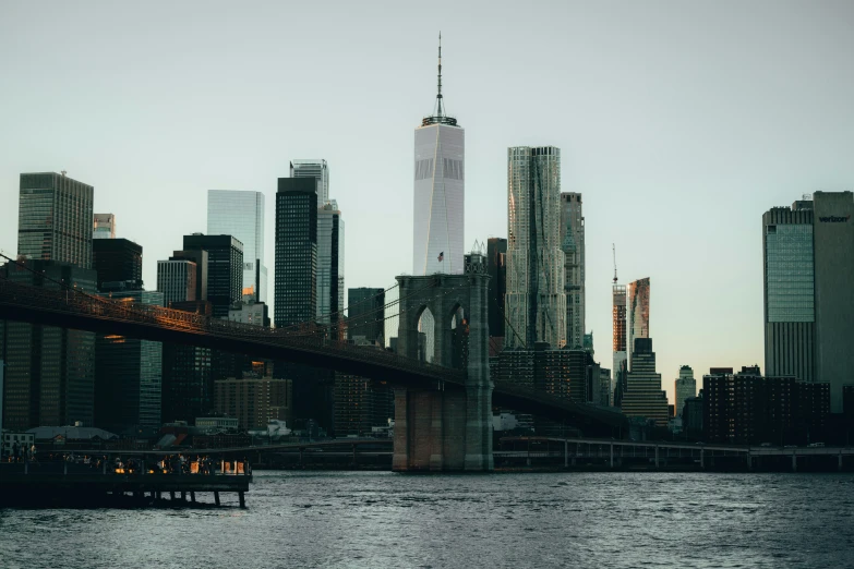 a very tall city skyline across a body of water