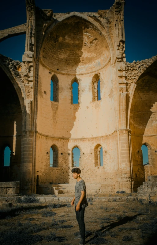 a man standing inside of an old building