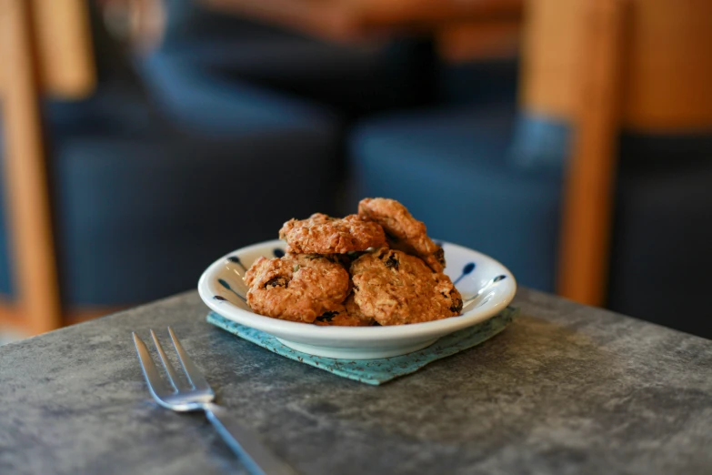 a plate of cookies on a table with forks