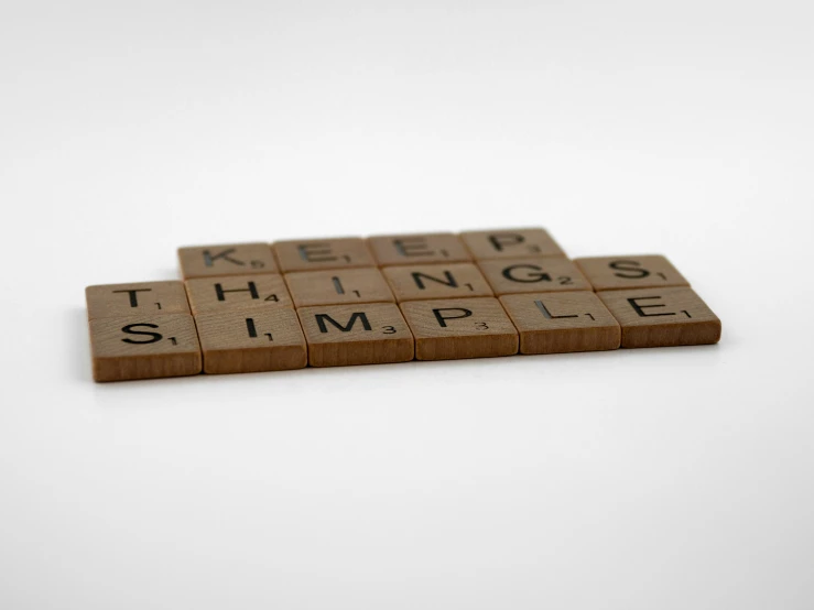 scrabble tiles arranged into the words keep things simple