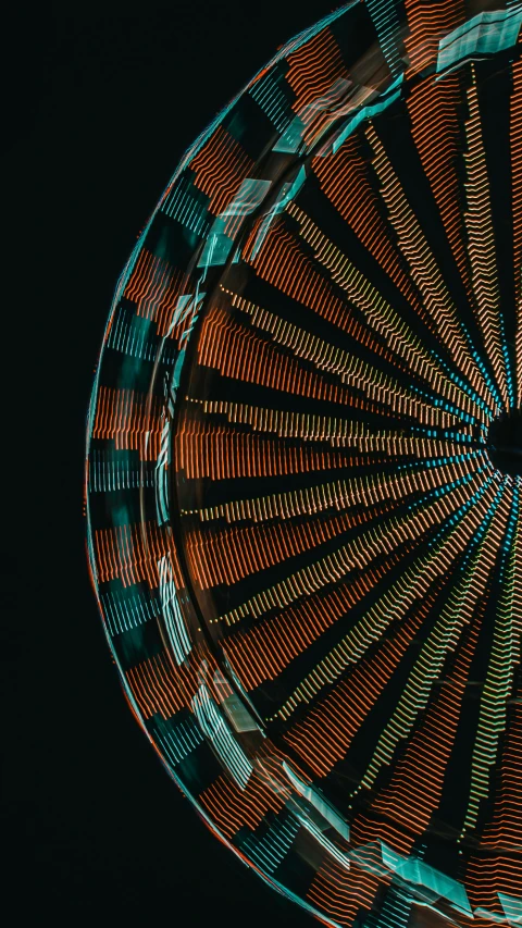 a large colorful fairground spinning on top of a wooden floor