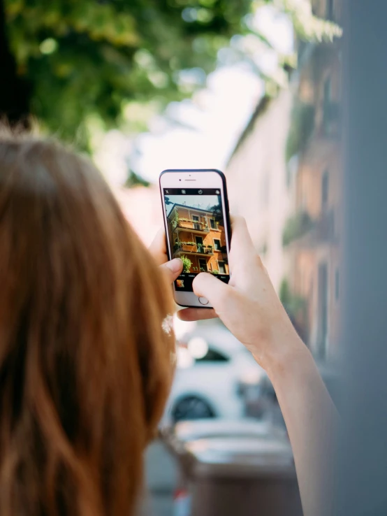 person holding up cell phone with pos displayed