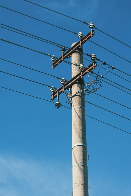 a tall pole with lots of wires attached to it